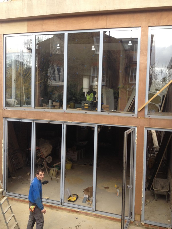 Aluminium bi-fold doors with two-storey glazing in Bermondsey