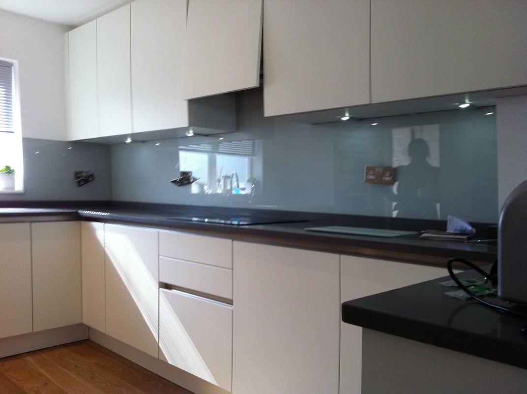 Grey glass kitchen splashback with LED lighting in Bermondsey
