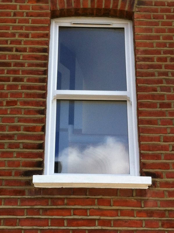uPVC sash window on Victorian red brick house in Bermondsey